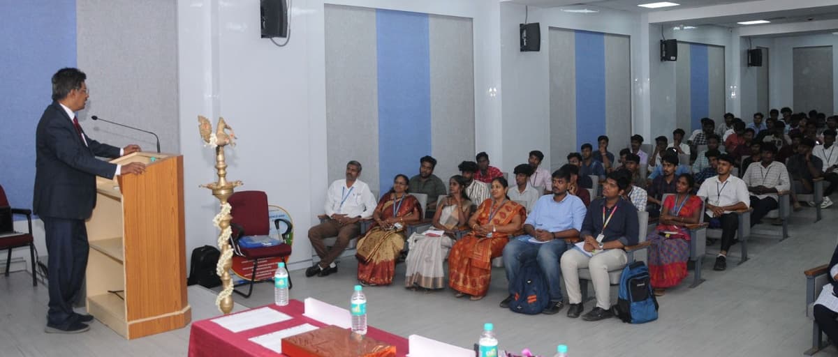 Dr. Sundararaman Chintamani delivering inaugural address at podium, ICAIFS'24 Easwari Engineering College