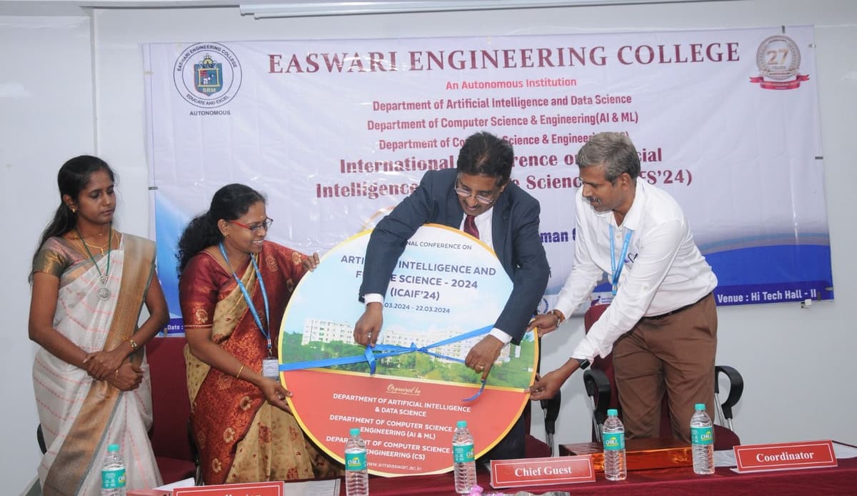 Dr. Sundararaman Chintamani inaugurating ICAIFS'24 conference poster with faculty at Easwari Engineering College