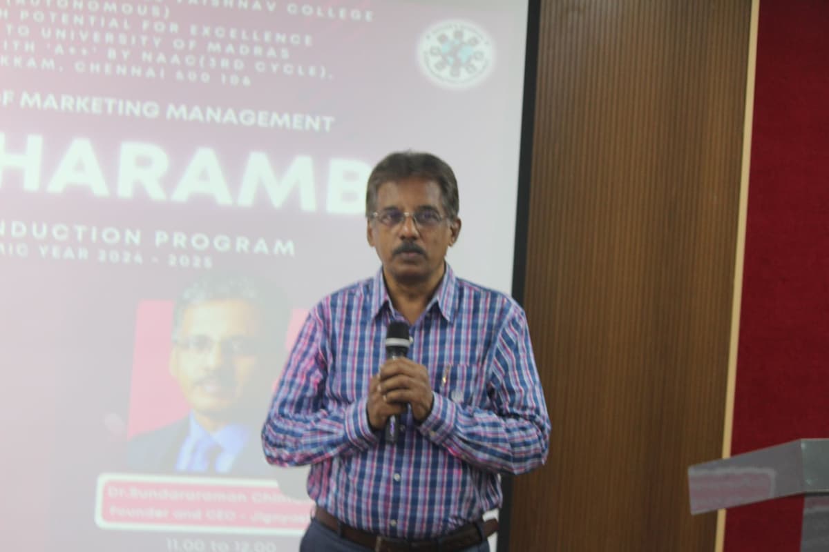 Dr. Sundararaman Chintamani speaking with Deeksharambh banner at DG Vaishnav College Chennai