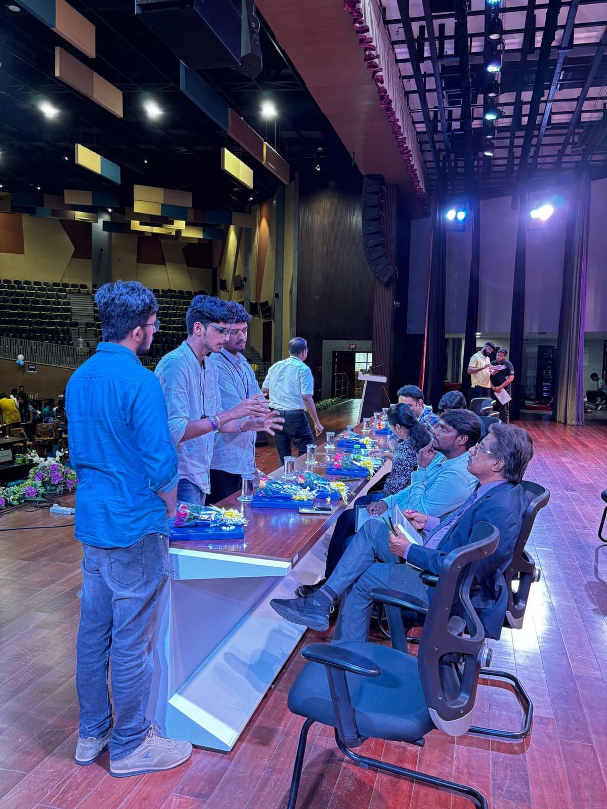 Teams presenting ideas to jury panel at Entropy hackathon