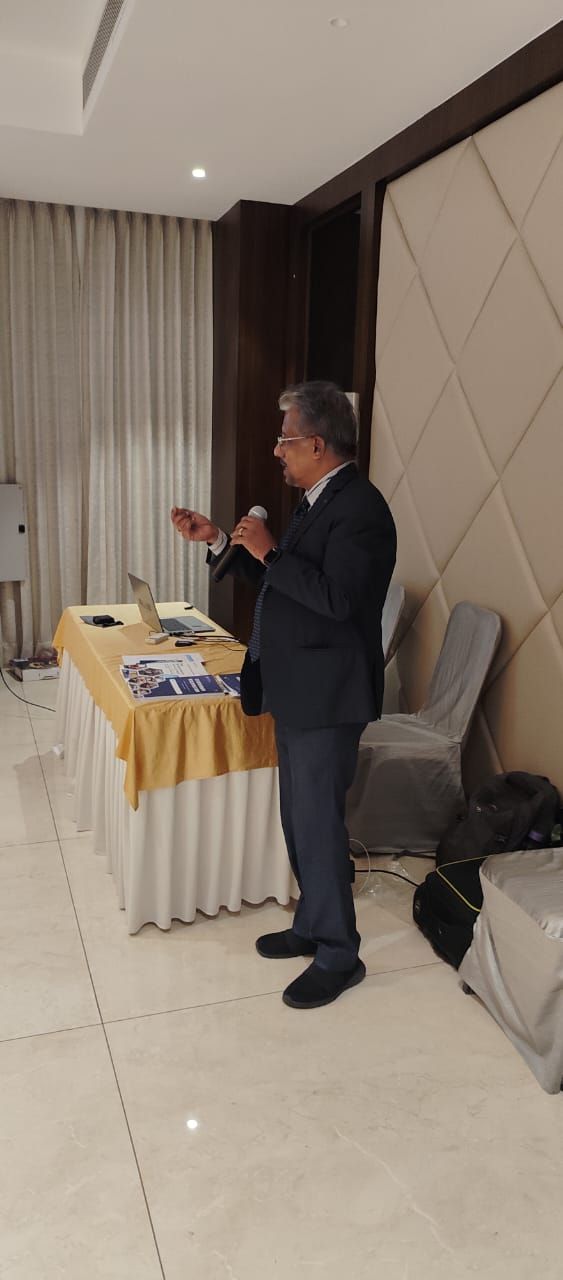 Dr. Sundararaman speaking with mic at CII Erode Leadership session