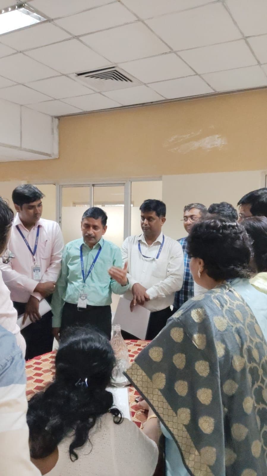 Chief Managers in group huddle activity during Practical Communication session at Indian Bank