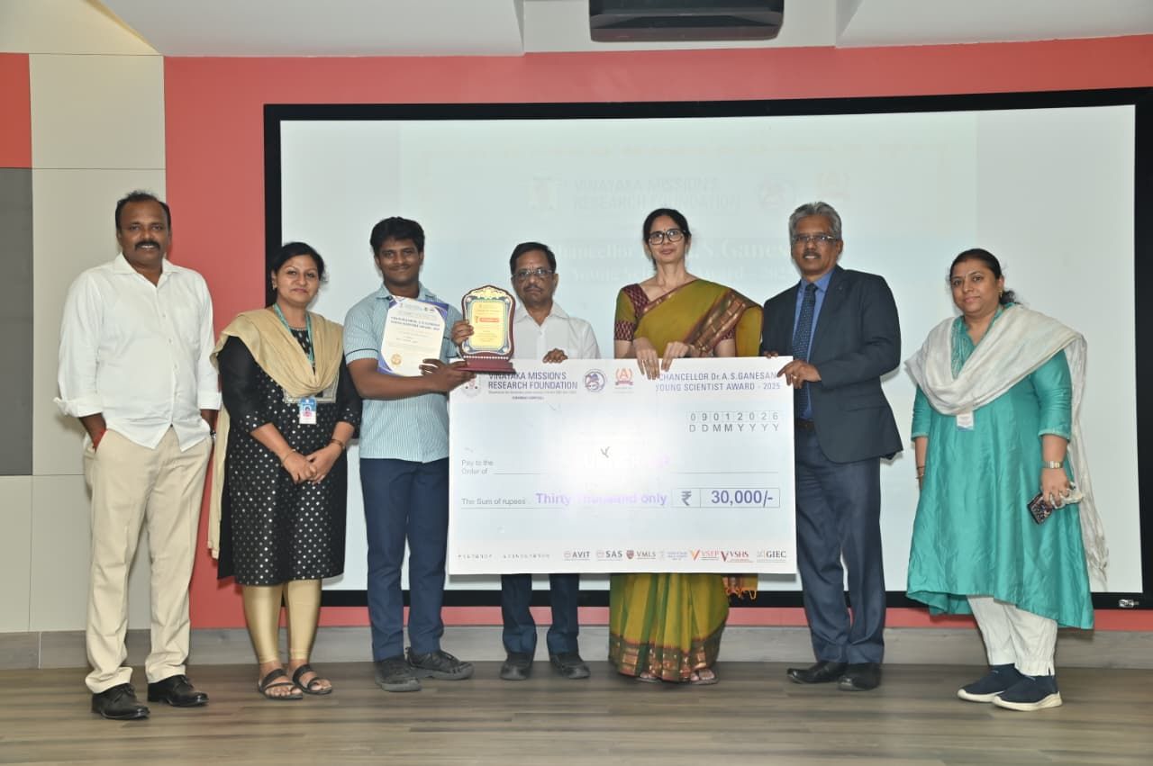 Presenting cheque to winning team at Young Scientists Award