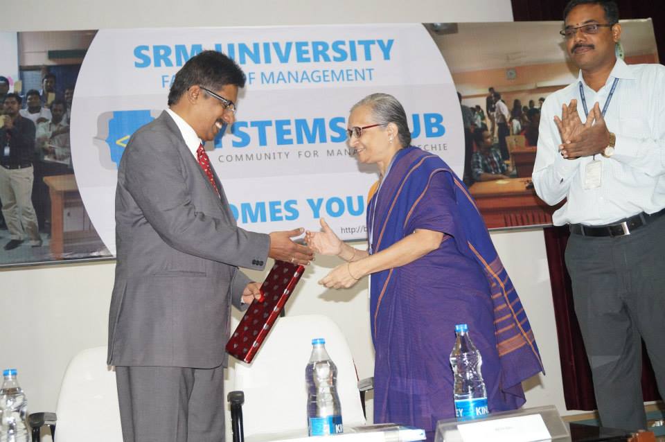 Receiving memento at Systems Club inauguration SRM University