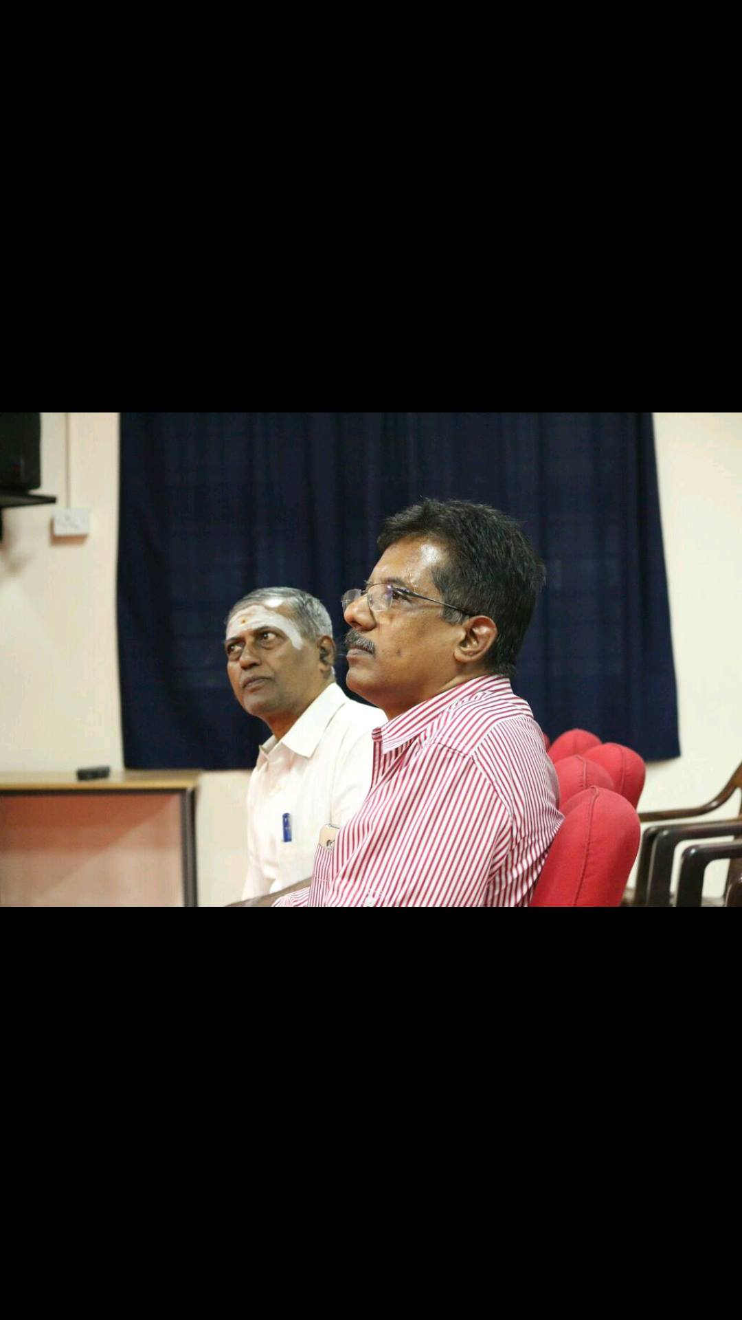 Dr. Sundararaman seated on dais at Bourgeon event Vivekananda College