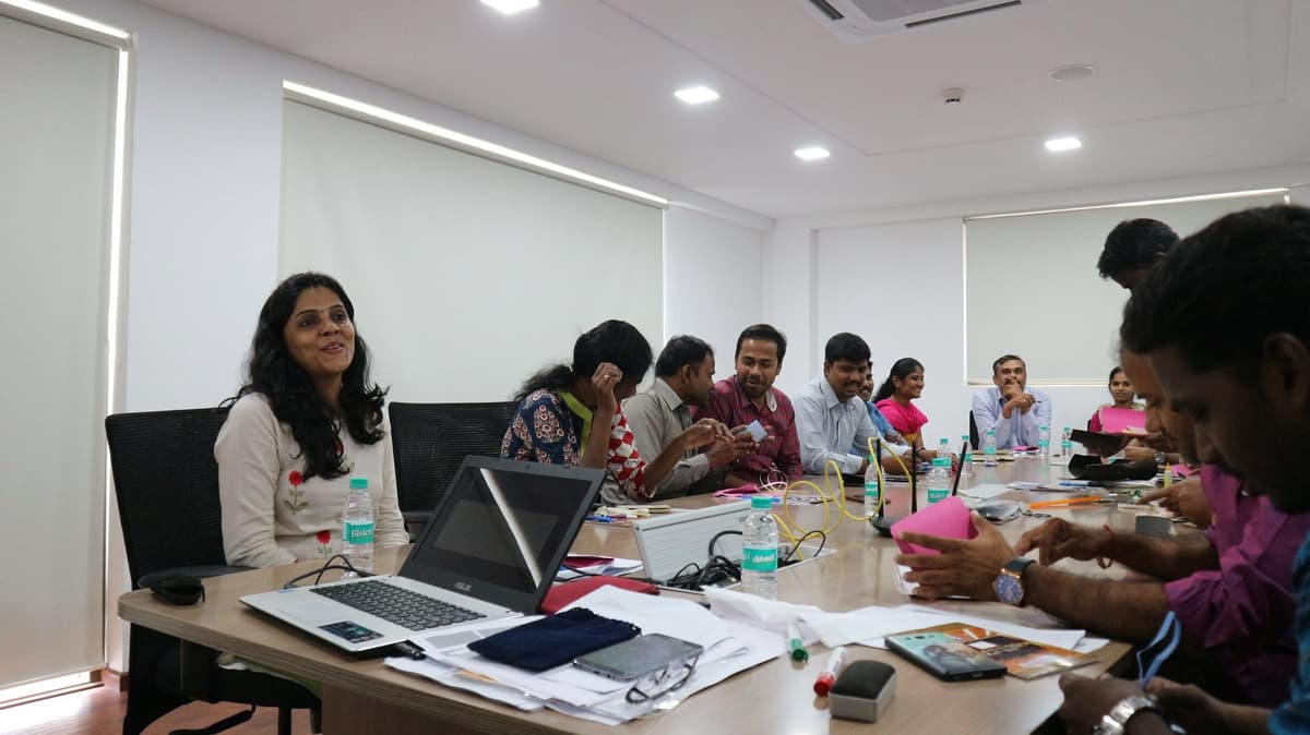 Co-facilitator and participants engaged in Design Thinking exercise at MMA