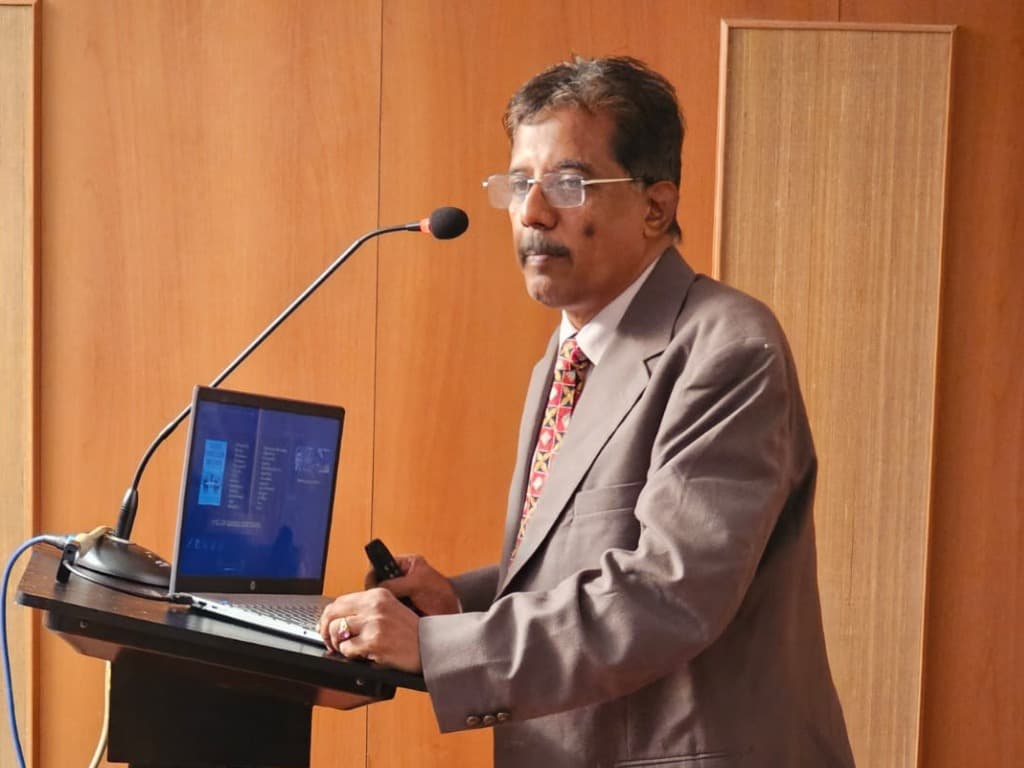 Dr. Sundararaman presenting Storytelling for Success at podium