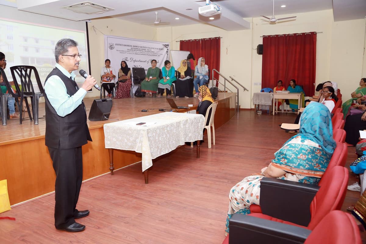 Dr. Sundararaman conducting inter-collegiate quiz at JBAS College auditorium