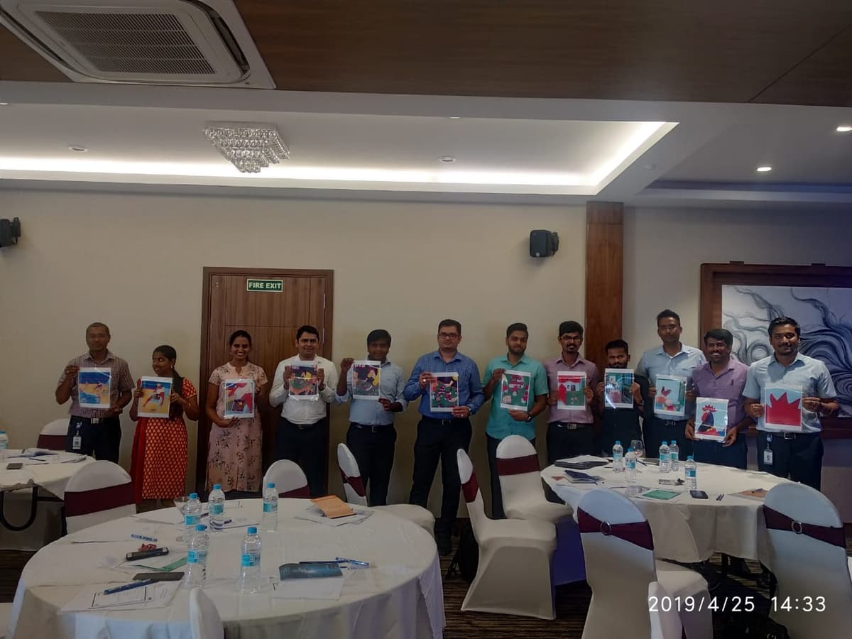 TVS Electronics Design Thinking workshop - participants with creative outputs