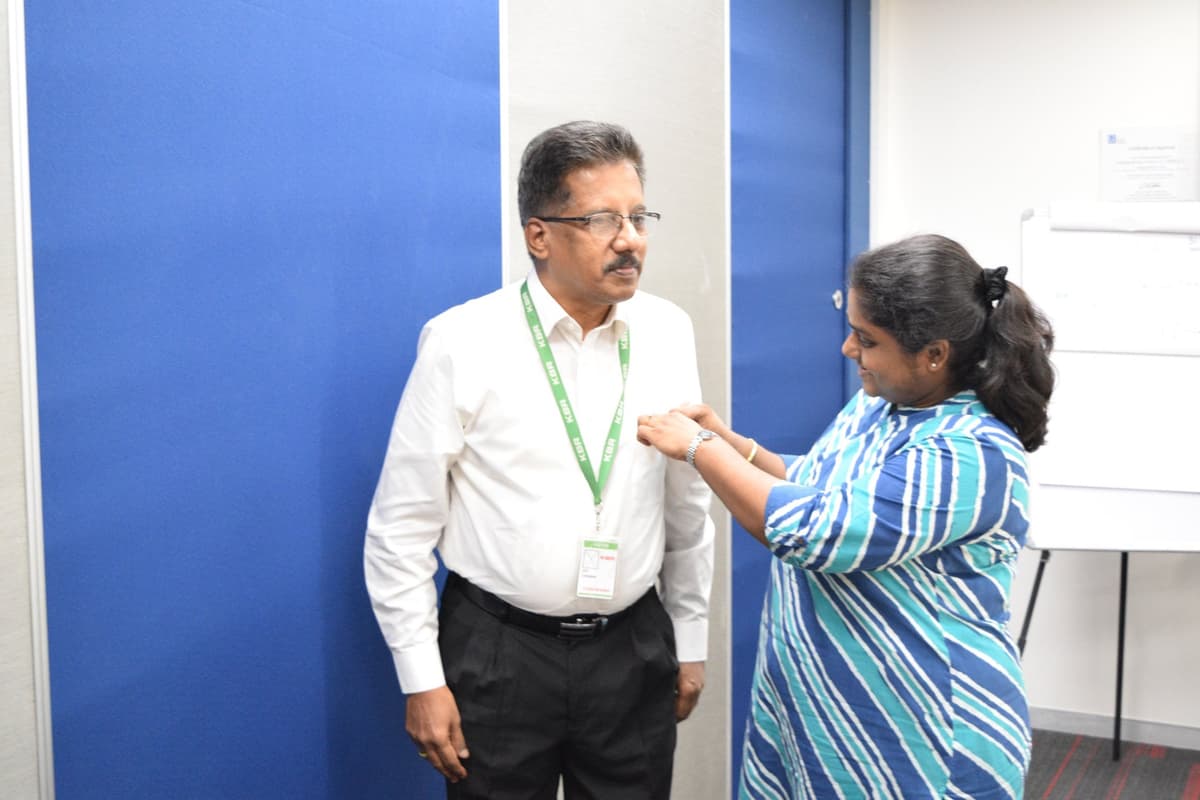 Dr. Sundararaman receiving Speechcraft completion badge at KBR