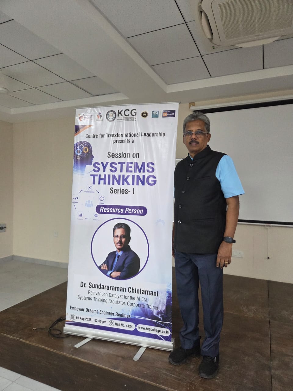 Dr. Sundararaman Chintamani beside the Systems Thinking Series I banner at KCG College of Technology, Chennai