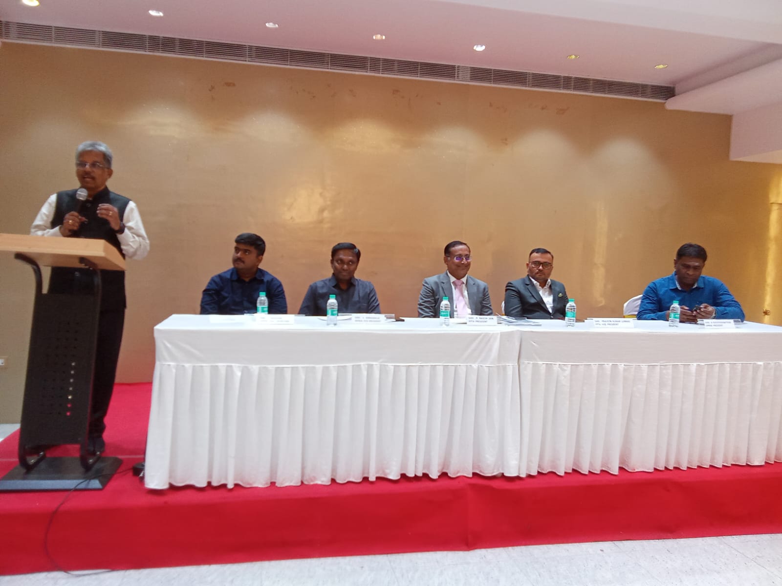 Dr. Sundararaman Chintamani addressing MPMA members with the FPTA President and office bearers on the dais