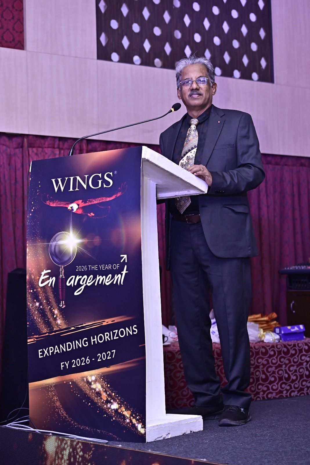 Dr. Sundararaman Chintamani at the Wings Expanding Horizons FY 2026-2027 podium