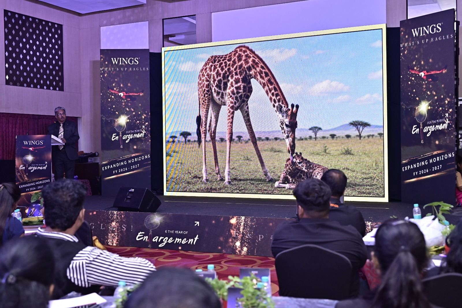 Baby giraffe story slide on feedback as fuel at Wings Brand Activations keynote