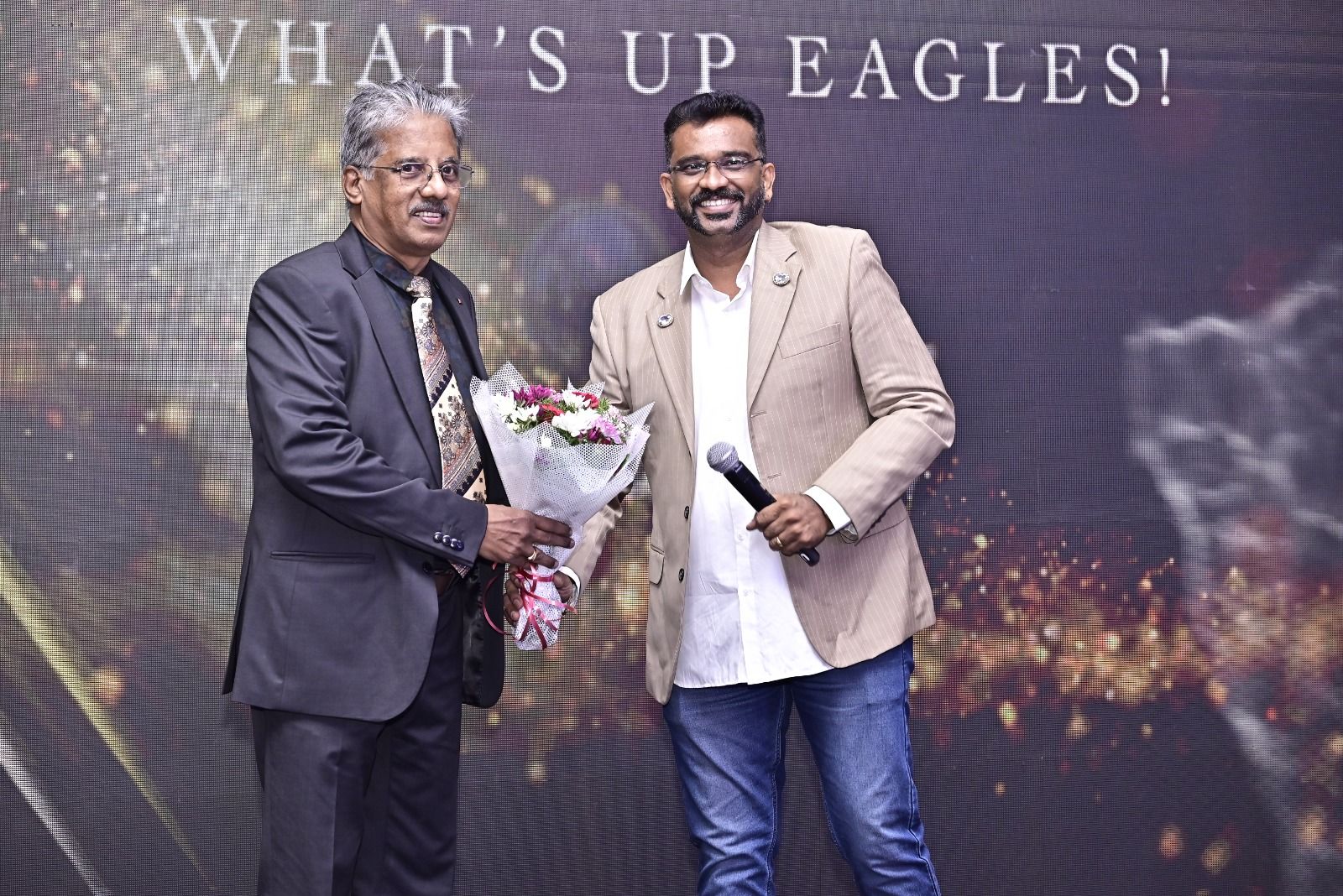 Dr. Sundararaman Chintamani receiving a bouquet at Wings Brand Activations annual event